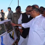 Federal Minister for Communications, Abdul Aleem Khan, being briefed by the administration about the breach in Gillani embankment on the NHA highway during his visit to flood-affected areas