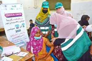 A lady health worker is administering cervical cancer vaccine to girl at Government shah bhitai hospital.