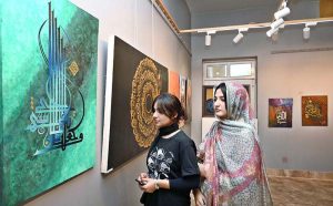 Visitors taking keen interest in calligraphy exhibition organized by Institute of Art and Design, University of Sargodha in connection with upcoming Eid Milad-un-Nabi (PBUH).