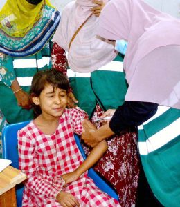 A lady health worker is administering cervical cancer vaccine to girl at Government shah bhitai hospital.