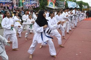 Children perform gymnastics during the Eid Milad-un-Nabi celebration procession at the Railway Station
