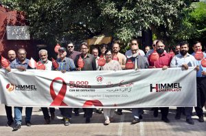 Professor Dr. Abbas Khokhar, Professor Dr. Kausar Bano, Dr. Usman Amin Butt, and others are participating in the Blood Cancer Awareness Walk organized by the Lahore Press Club in collaboration with Himmel Pharmaceuticals.