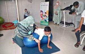 A physiotherapist conducts a session with a child at Adil Special School and Rehabilitation Center on the eve of World Physiotherapy Day.