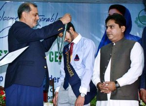 Divisional Commissioner Raja Jahangir Anwar awards gold medals and certificates to position holders during the Intermediate result announcement ceremony at Shehzad Hall of Divisional Model College