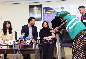 Lady Health Workers administering an HPV vaccine to the daughter of Federal Health Minister, Syed Mustafa Kamal, at the DRAP Office as part of efforts to counter propaganda against vaccination