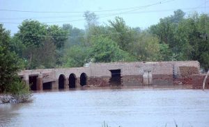 A view of submerged houses as a deadly flash flood hits Tehsil Bhuwana-Lalian Road near the Chenab River, displacing thousands of people and severely disrupting daily life.