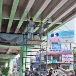 PHA workers busy in panting Kalma chowk fly over.