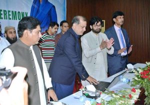 Divisional Commissioner Raja Jahangir Anwar awards gold medals and certificates to position holders during the Intermediate result announcement ceremony at Shehzad Hall of Divisional Model College