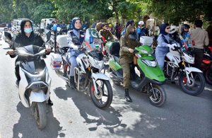 Traffic police women riding bikes after the inauguration of the Women’s Bike Rally at D-Ground.