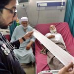 A doctor examining a patient with heart-related complications at Lady Reading Hospital on World Heart Day