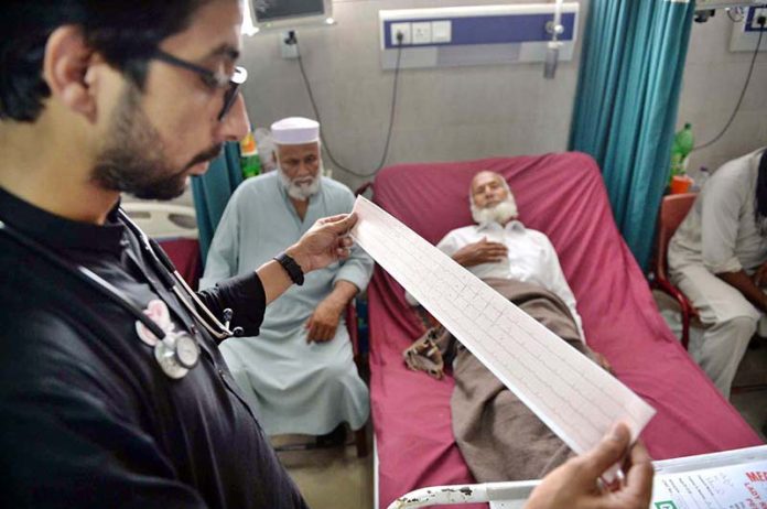 A doctor examining a patient with heart-related complications at Lady Reading Hospital on World Heart Day