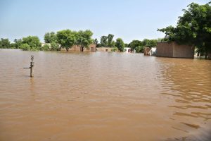 A view of submerged houses as floodwaters inundate several villages