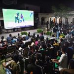 People are watching the live Asia Cup final match between Pakistan and India on big screen outside Niaz Cricket Stadium