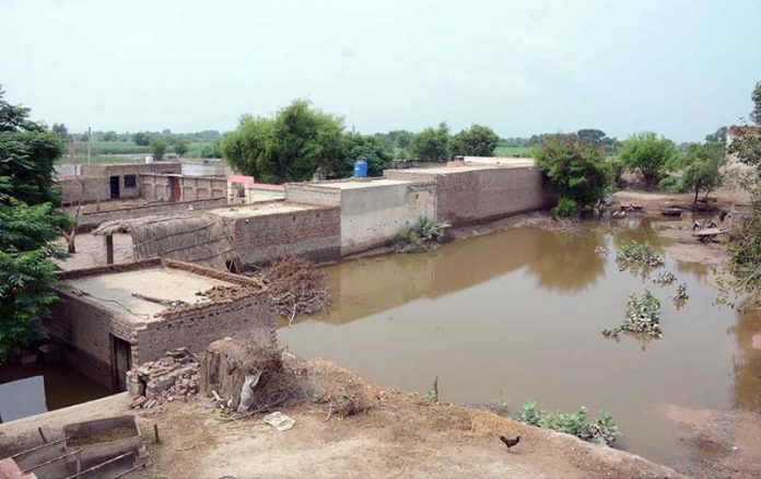 A view of submerged houses after a deadly flash flood hit Village Kalri, Tehsil Bhuwana, Lalian Road, near the Chenab River, displacing thousands of people and severely disrupting daily life