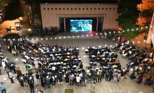 People are watching the live Asia Cup final match between Pakistan and India on big screen outside Niaz Cricket Stadium