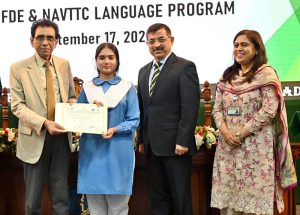 Federal Minister for Education and Professional Training Khalid Maqbool Siddiqui cuts the ribbon to inaugurate the IT Lab at Islamabad Model College for Girls, G-11/1.