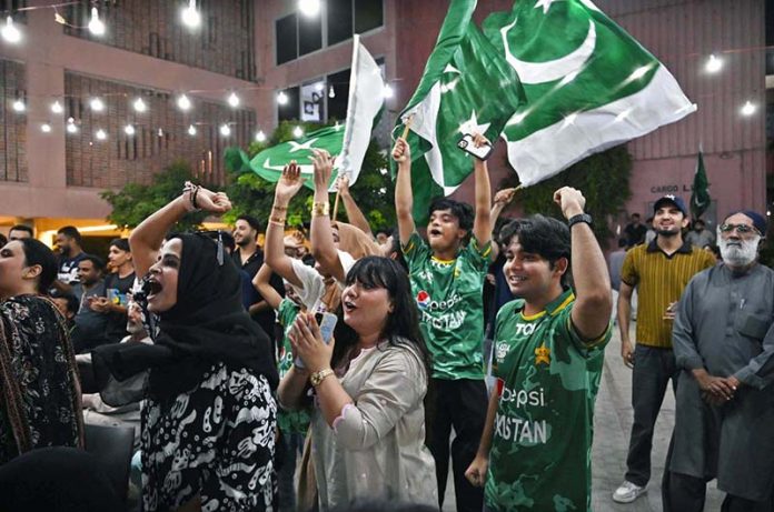 People are watching the Asia Cup T20 final cricket match between India and Pakistan on a big screen at the Arts Council