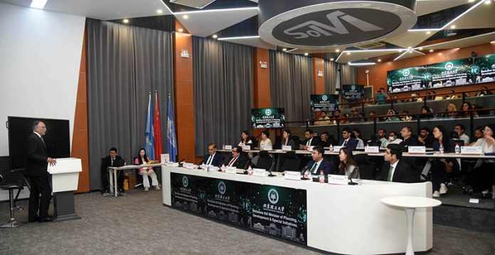 Federal Minister for Planning, Development and Special Initiatives, Professor Ahsan Iqbal, addressing the management and students during his visit to Beijing Institute of Technology
