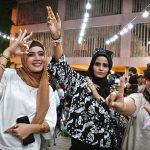 People enjoy watching the Asia Cup T20 final cricket match between India and Pakistan on a big screen at the Arts Council