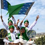 Children carrying flags during participate in a religious procession to celebrate Eid-e-Milad-un-Nabi(S.A.AW), commemoration of the birth anniversary of Prophet Muhammad(PBUH)