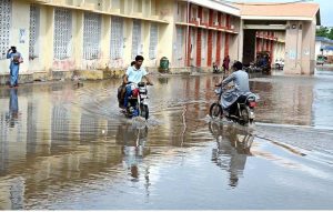 Motorcyclists, pedestrians and patients are facing difficulties due to rainwater accumulation in front of Chandka Civil Hospital after heavy rain.