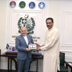 Federal Minister for Defence Production Muhammad Raza Hayat Harraj presents a souvenir to Reza Amiri-Moghaddam, Ambassador of the Islamic Republic of Iran, in Rawalpindi