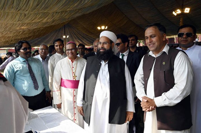 Chairman Pakistan Ulema Council, Hafiz Muhammad Tahir Ashrafi, visiting a stall during the Job Fair ceremony at St. Anthony School Regal