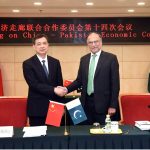 Federal Minister for Planning, Development and Special Initiatives, Professor Ahsan Iqbal, shaking hands with Zhou Haibing, Vice Chairman, after the 14th meeting of the Joint Cooperation Committee (JCC) of CPEC