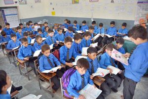 Students attend their class on International Literacy Day at Government Shaheed Wahabuddin High School, Salwan Cantt.