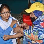 A lady health worker is administering cervical cancer vaccine to student at Government Muslim Girls High School, Eidgah Road.