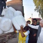 Federal Minister for Board of Investment Qaiser Ahmad Shaikh distributing food of animals in flood affected areas of Chiniot