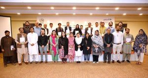 Additional IG (Gender & Human Rights) Ms. Aneela Naz, Deputy Chief KPCPWC Ijaz Khan, and UNICEF Child Protection Specialist Sohail Ahmed pose for a group photo with officials and participants during the launching ceremony of the State of Children in Pakistan 2024 Report and Situation Analysis on Children from Minority Religions in Pakistan Report 2024.