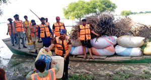 Student volunteers from Islamia University of Bahawalpur join hands with Rescue 1122 in relief activities for flood-affected people at Mari Qasim Shah area on the Sutlej River hit by deadly flood .