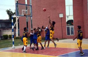 A player attempts a throw into the basket during the match between Sandal College and Divisional Public School & College in the Inter School & College Sports Championship 2025 at Divisional Public School & College