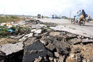 The view of Korangi Causeway road seen in a dilapidated condition after the flood.