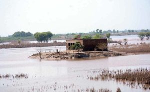 A view of the damaged road after flooding in the Ravi River.