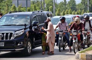 Beggars asking for mercy from a commuter on 9th Avenue in the federal capital.