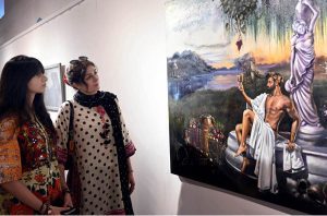Visitors admire outstanding artworks on display during the Degree Show at the NCA Gallery