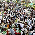 A large number of people participating in the Eid Milad-un-Nabi procession at the Jinnah Bagh Road