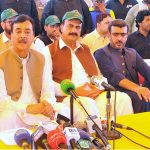 Acting President Syed Yusuf Raza Gilani talking to media after receiving a briefing from NHA officials during his visit to the Gilani Bund breach section on Motorway M-5