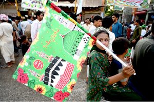 A large number of people participating in the Eid Milad-un-Nabi procession at the Jinnah Bagh Road