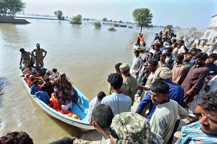 Residents being evacuated by rescue teams and boats to safer areas as rising waters from rivers submerge parts of South Punjab