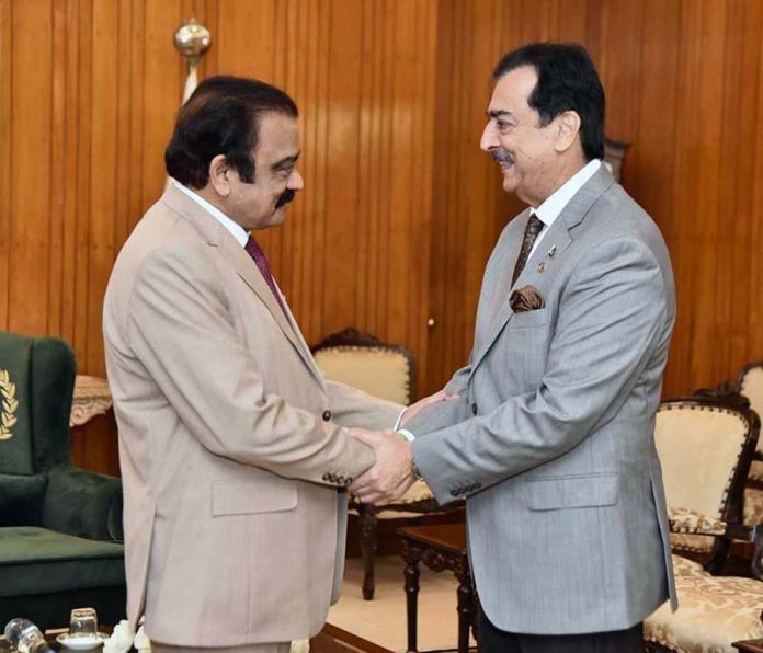Acting President Syed Yousuf Raza Gilani shakes hands with Senator Rana Sanaullah Khan at Aiwan-e-Sadr, in federal capital