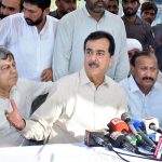 Chairman Senate Syed Yousuf Raza Gilani talking to media at Ghalloo School, Jhok Wains, where flood relief camps have been established