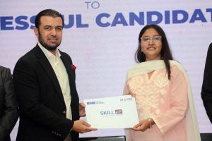 Advisor to Federal Finance Minister, Khurram Schehzad distributing certificates to graduates of the “Skill-Up Batch-II” program at Iqra University