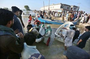 Residents being evacuated by rescue teams and boats to safer areas as rising waters from rivers submerge parts of South Punjab