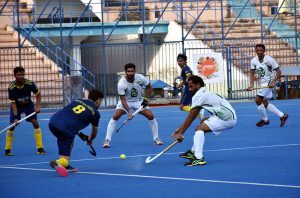 Players in action as they vie for the ball during the hockey match between National Bank of Pakistan and Pakistan Customs in the 4th Chief of the Naval Staff All Pakistan Hockey Tournament 2025.