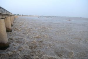 A view of Low-level Flood waters passing through at Indus River Kotri Barrage Jamshoro.