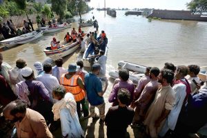 Residents being evacuated by rescue teams and boats to safer areas as rising waters from rivers submerge parts of South Punjab