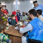 An Afghan refugee family being de-registered by UNHCR staff at the Voluntary Repatriation Centre before leaving their homeland Afghanistan